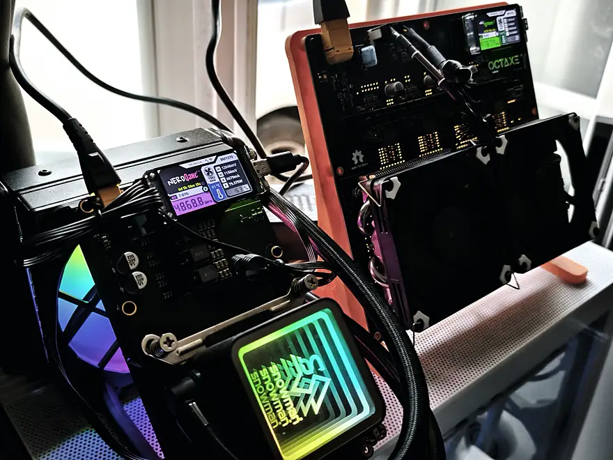 A water-cooled NerdQaxe++, next to a NerdOctaxe